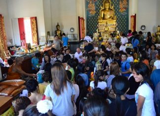 Buddhists gather at Wat Chaiyamongkol in South Pattaya to present Sangkhathan (necessary items for monks) and make merit on Visakha Bucha Day.